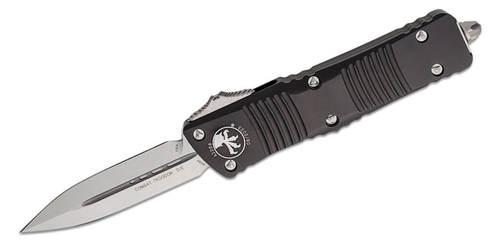 microtech-142-10-combat-troodon-dual-action-otf-3-81-m390-stonewashed-dagger-blade-black-anodized-6061-t6-aluminum-handle-with-glass-breaker